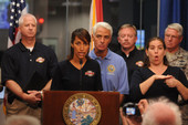 Monesia T. Brown, Executive Director of the Agency for Workforce Innovations (AWI), addressing the media during Tropical Storm Fay.