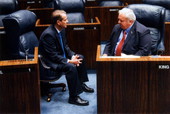 Florida State Senator Alex Villalobos, left, conferring with Senator Jim King.