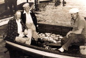 Unidentified men in boat with their catch of 125 Pompano at Layton's Park - Riviera Beach, Florida.