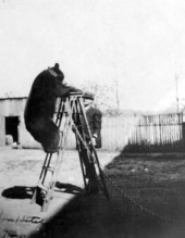 J.D. Hutchison and his tame bear - Tallahassee, Florida.