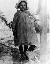 Outdoor portrait of young girl with her dog in Mayport.