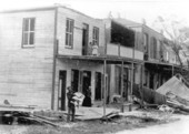 Victims gathered by building devastated by hurricane - Cedar Key, Florida