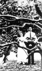 Couple under grapefruit tree