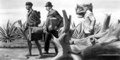 Barefoot mailman and foot passengers as depicted in West Palm Beach post office mural.