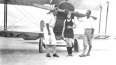 Winter visitors in front of biplane - Atlantic Beach, Florida