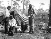 African Americans having their hair cut.