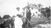"Uncle Al" and Ruth Pollard in their back yard fetching wood for the stove - De Land, Florida