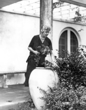 Congresswoman Ruth Bryan Owen pruning bushes