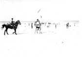 Patrolman on horseback approaching lifeguard station at Butler Beach - Anastasia Island, Florida
