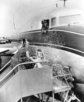 June Knight christening a DC-6 transport plane