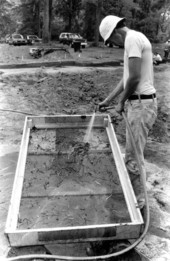 Worker screening dirt for signs of Hernando de Soto's 1539 winter encampment - Tallahassee, Florida