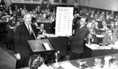 Dr. Joe Hall (left) explaining a chart dealing with teacher salaries on the House floor - Tallahassee, Florida.
