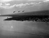 Aerial view showing 3 seaplanes flying near the city - Jacksonville, Florida.