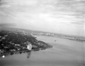Aerial view looking along the Saint Johns River towards the city - Jacksonville, Florida.