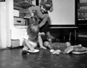 Unidentified children playing with food at George Brunette's School of Art - Jacksonville, Florida.