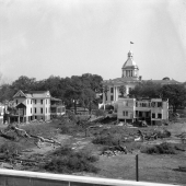 Two views of the demolition of homes surrounding the Capitol