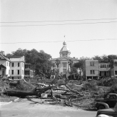 Two views of the demolition of homes surrounding the Capitol