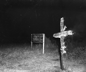 Cross burning by the Ku Klux Klan, in protest of a suspected communist