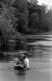 Preacher performing baptism in Leon County, Florida.