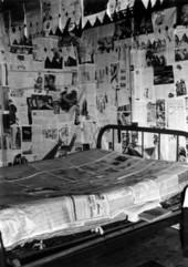 Mattress prepared with newspaper for delivery by expectant mother.