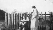 African American mother and twins being visited by a nurse from the Taylor County Health Unit.