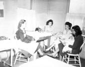 Public health nurses advising mothers on child care in Tampa, Florida.