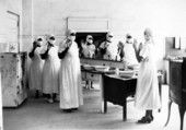 Sterile procedures taught to midwives for licensing in Miami, Florida.