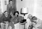 Unidentified family receives their telephone installation.