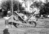 Unidentified worker with a Caterpiller Tractor Scraper