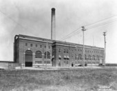 Old industrial building with a smokestack.