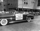 Governor Dan McCarty riding in the Shriners parade on Monroe Street in Tallahassee, Florida.