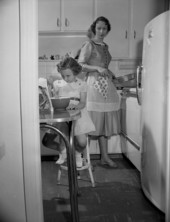 Jean Gatlin and daughter Margaret Ellen (age 5) in the kitchen in Tallahassee, Florida.
