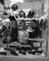 Young women window shopping at Turner's store in Tallahassee, Florida.
