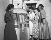 Women at the jukebox during New Year's Eve party in Tallahassee, Florida.