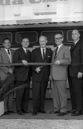 Governor Farris Bryant cutting the ribbon during an opening ceremony.