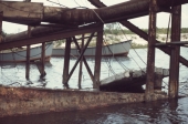 Close-up view showing storm damage to a structure at Alligator Point, Florida.