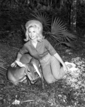Unidentified woman petting a deer at Homosassa Springs.