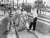 Four people play miniature golf - Saint Augustine, Florida.