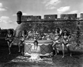 Young women and a young boy in front of a fort for the premiere of the movie "Distant Drums" - Saint Augustine, Florida