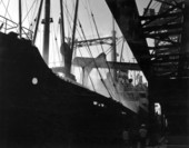 Ship docked at loading elevator..