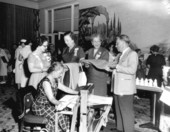 Women with materials made from ramie on a loom - Miami Beach, Florida