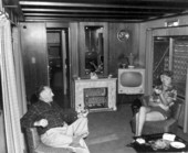 Unidentified couple in their living room at their trailer home - Sarasota, Florida .