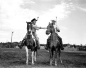 Unidentified cowboys with their horses - New Smyrna Beach, Florida .