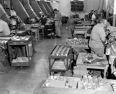 Interior view showing employees working at the Perkins Marine Lamp and Hardware Corporation in the Sunshine State Industrial Park - North Miami, Florida.