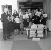 Group holding up the Miami Herald during newspaper strike in New York.