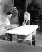 Workers finishing desk tops - Miami, Florida .