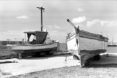 Haitian and Cuban refugee boats on pier D-2, United States Coast Guard station, Trumbo Point Annex, Key West, Florida..