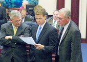 Republican Leader Andy Gardiner, center, conferring with colleagues on the House floor during the 2006 Legislature.