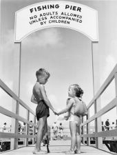 Children at the entrance to fishing pier